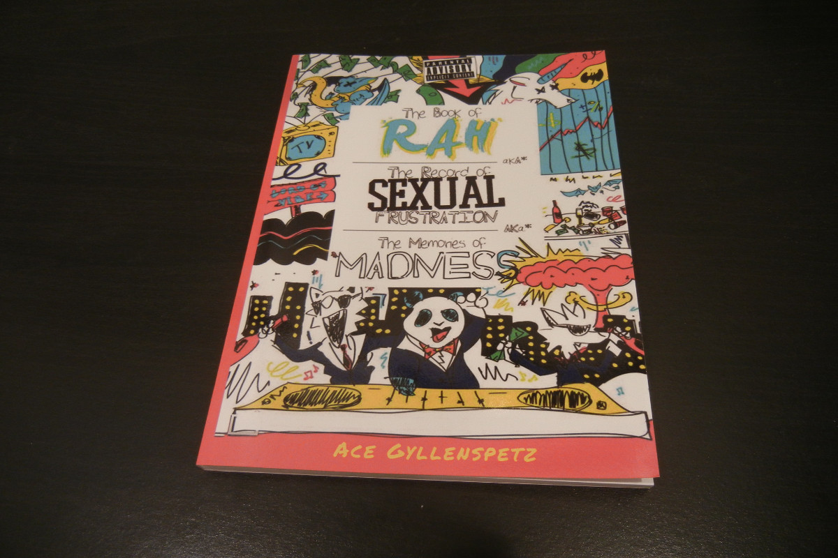 The Book of Rah laying on a table.